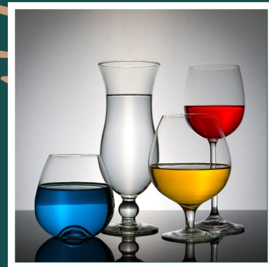 Product photograph of coloured drinks in clear glassware